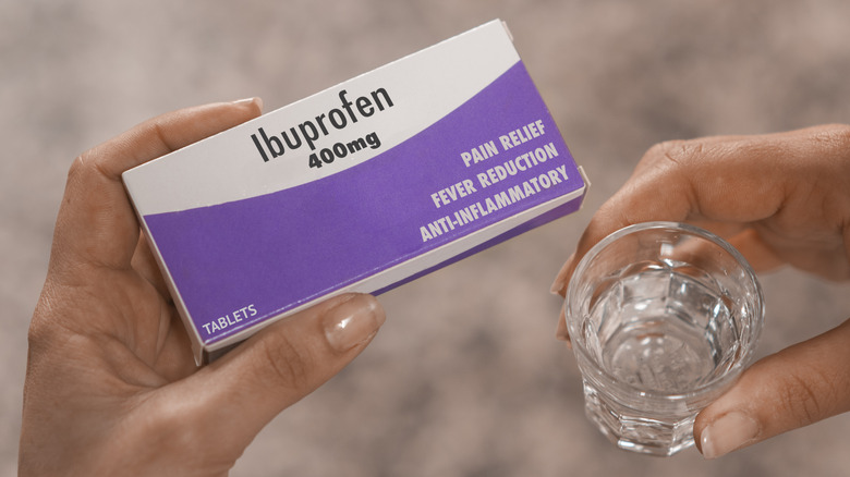 Ibuprofen and glass of water