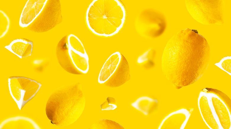 Lemon slices on yellow background