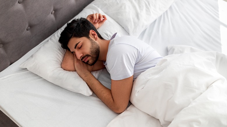 Man sleeping in bed