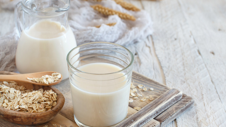 Pitcher and glass of oat milk