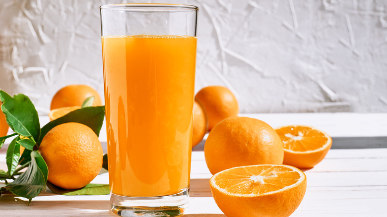 Oranges and glass of orange juice