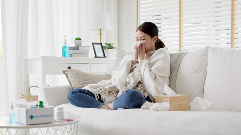 Asian woman sick at home 