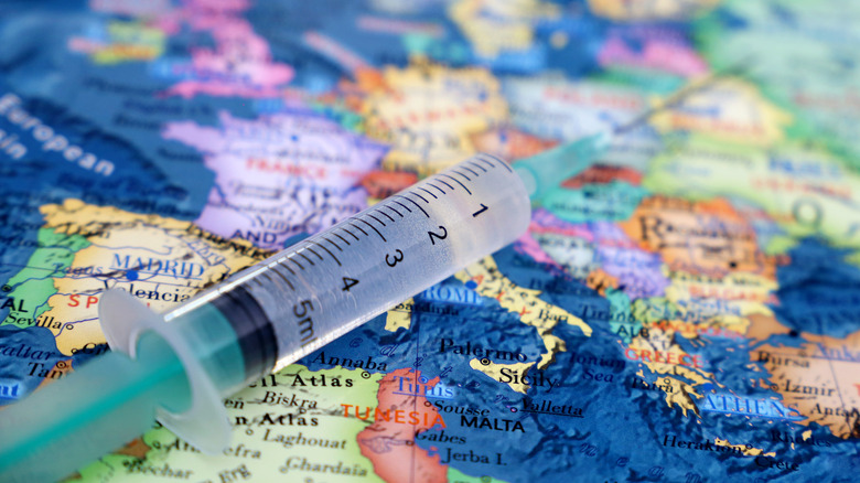 world map with vaccine