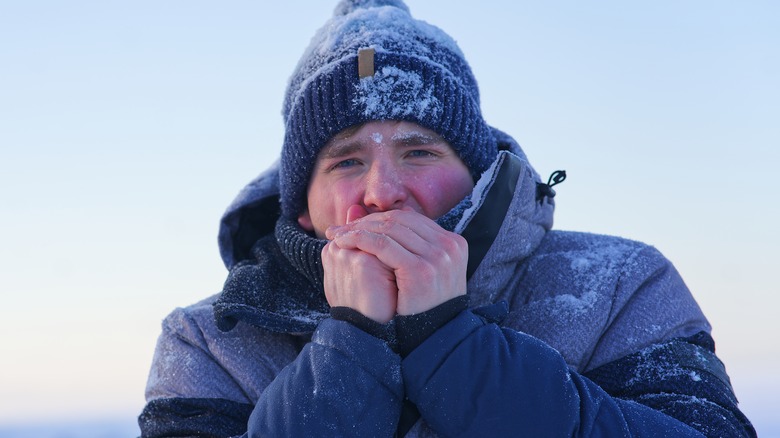 cold man covered in snow