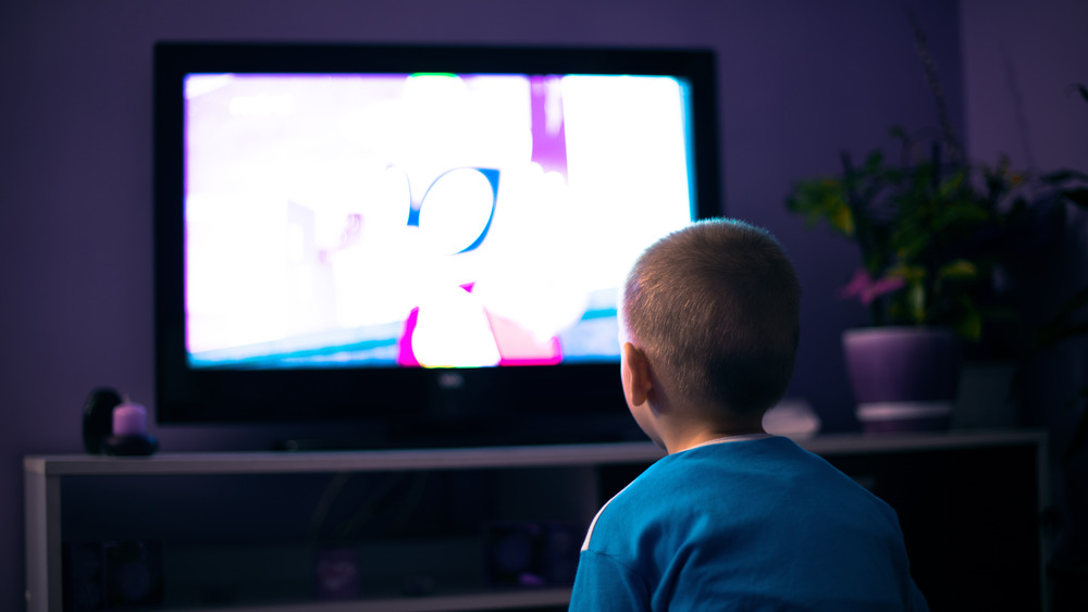 boy watching TV close