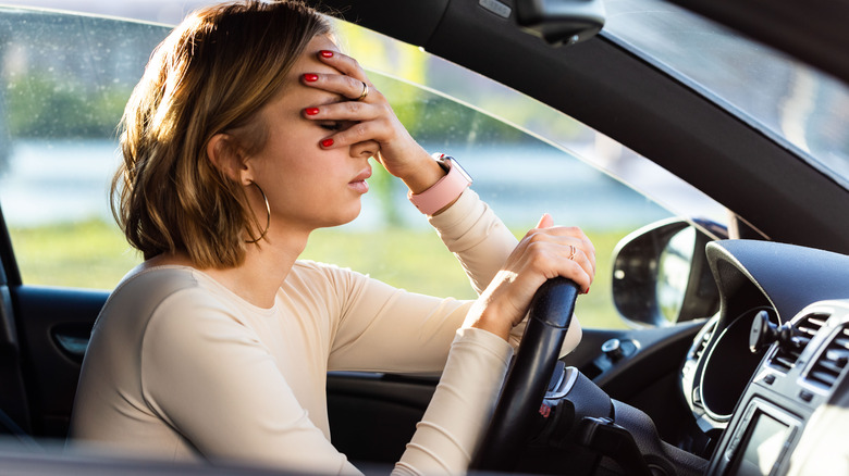 stressed out woman in car