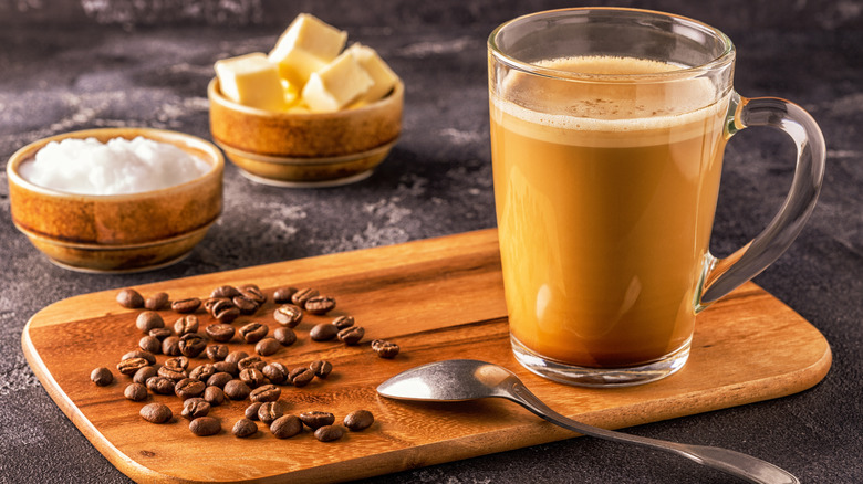 Mug of coffee, butter, coffee beans