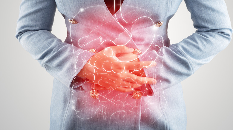 Woman touching stomach