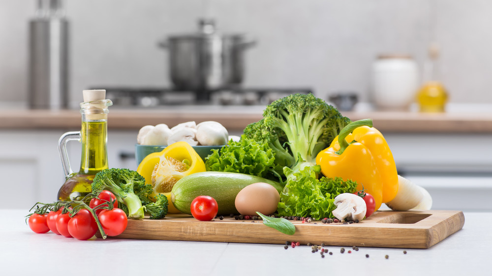 A variety of vegetables on a cutting board 