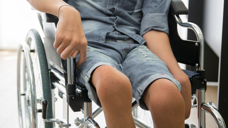 Boy with polio in wheelchair