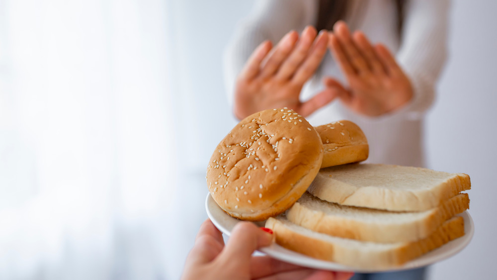 woman refusing bread