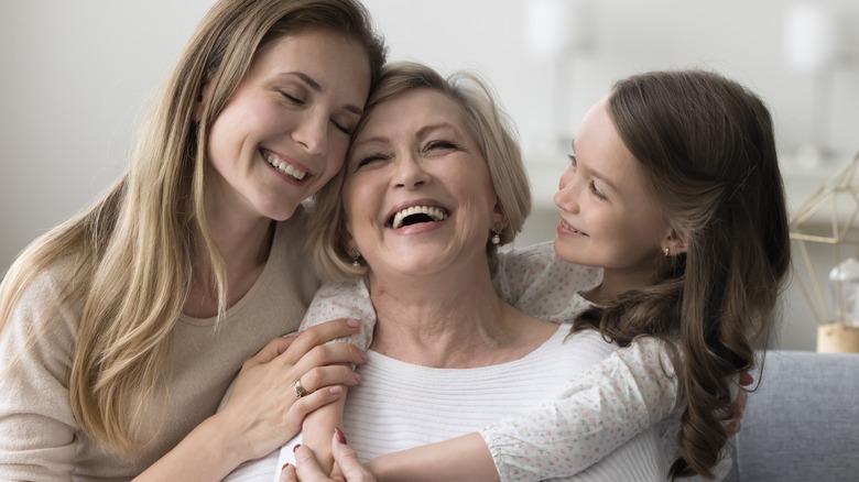 happy mother, daughter, and granddaughter