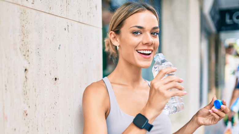 Woman drinking water bottle