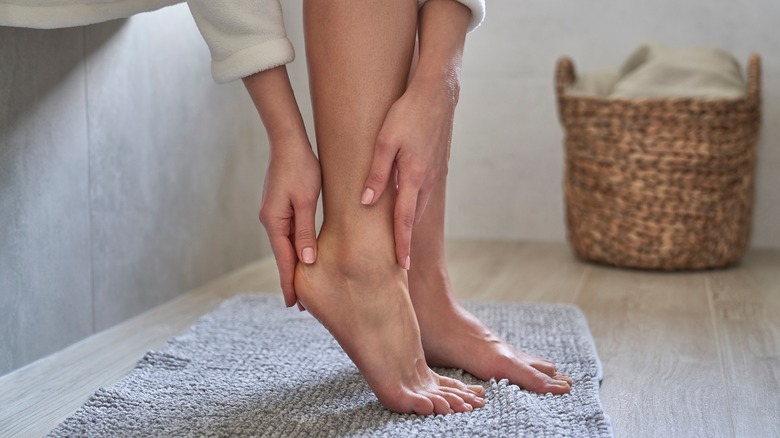 Woman rubbing her feet 