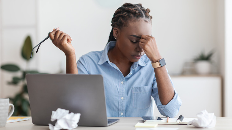 Woman feeling fatigue at desk