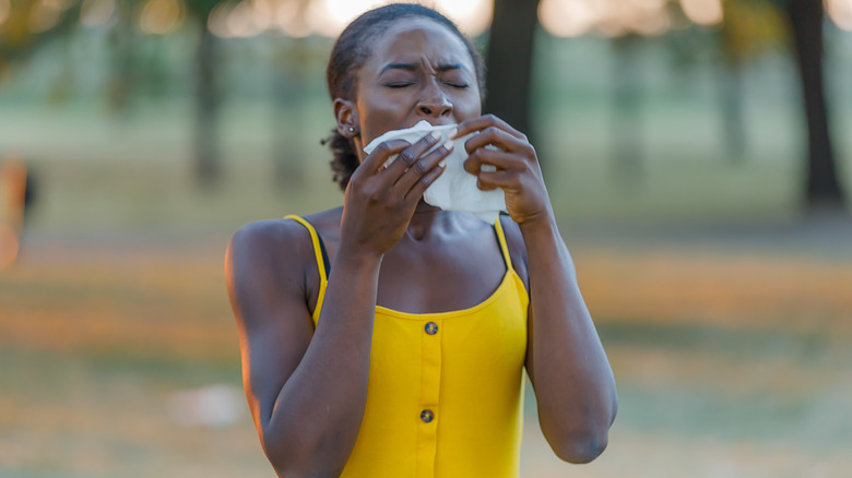 A woman about to sneeze 