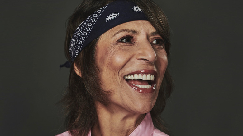 Dominique Crenn smiling and wearing headband