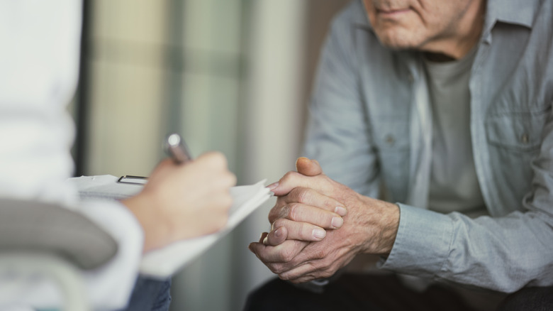 older man taking cognitive test