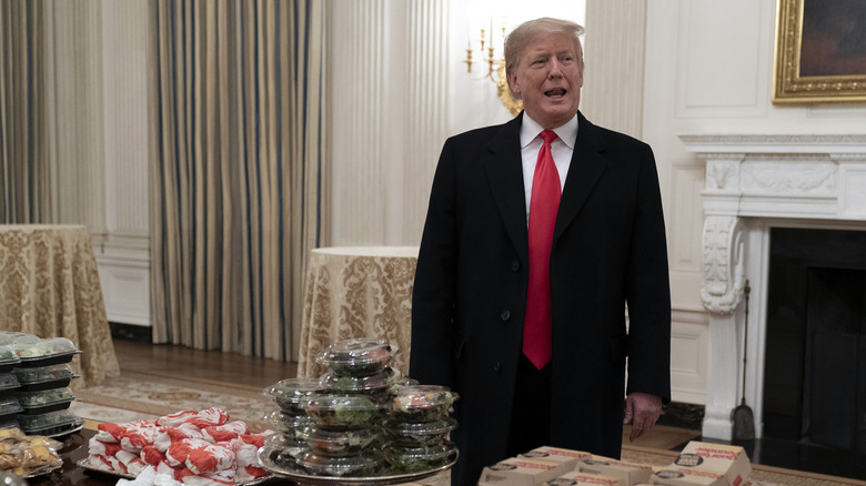 President Donald Trump standing in front of fast food