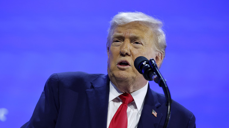 Trump behind podium speaking