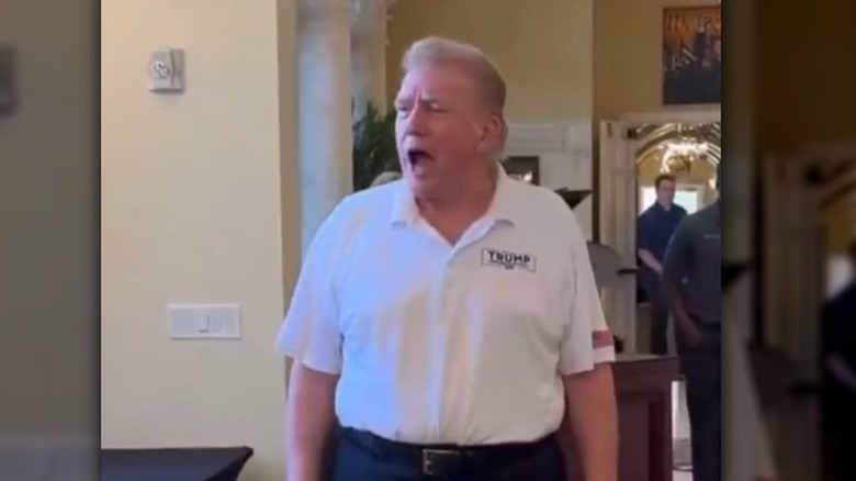 Donald Trump talking to people at Mar-a-Lago