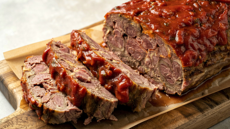 A meatloaf sliced on a chopping board