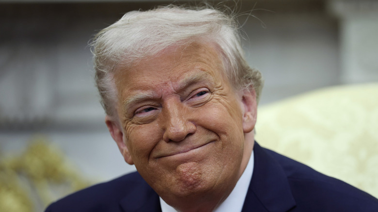 President Donald Trump smiling as he meets with President Bukele