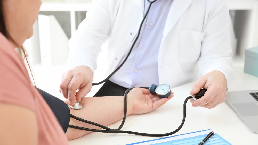 doctor with obese patient