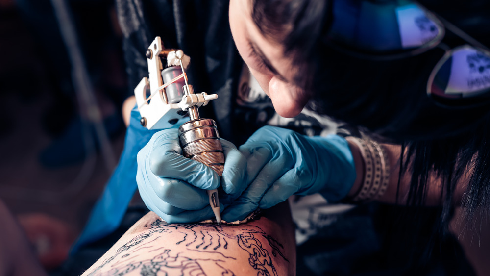 close up of a tattoo artist working 