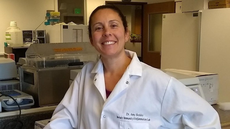 Dr. Amy Beckley in her lab, wearing a personalized lab coat