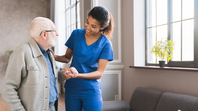 A patient receiving assistance in a clinical setting