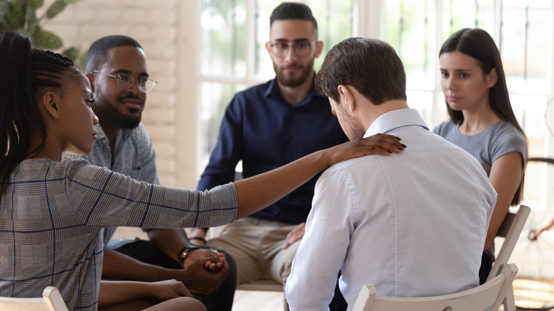 People sitting in a circle for a support group