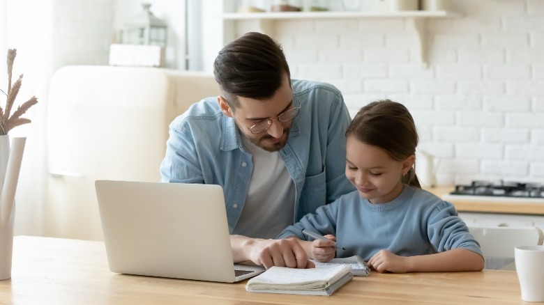 parent helping child 
