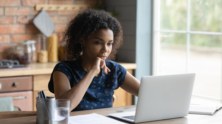 woman at computer conducting research