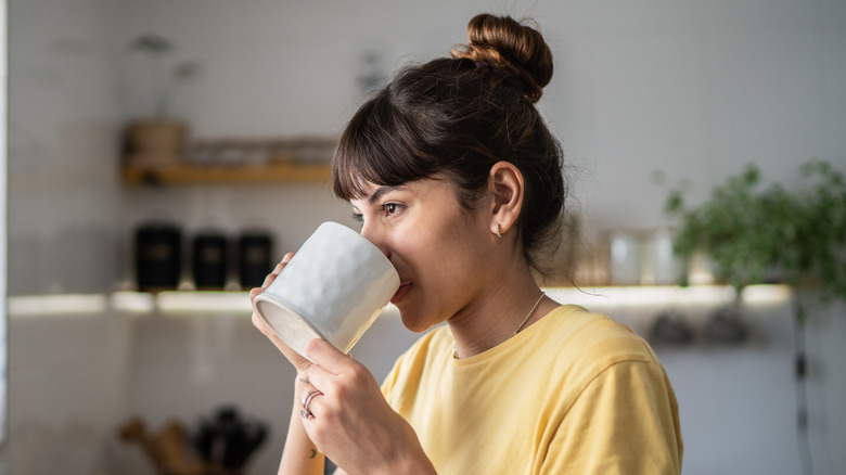 Woman drinking beverage