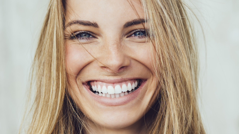 Woman smiling showing teeth