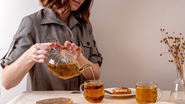woman pouring tea
