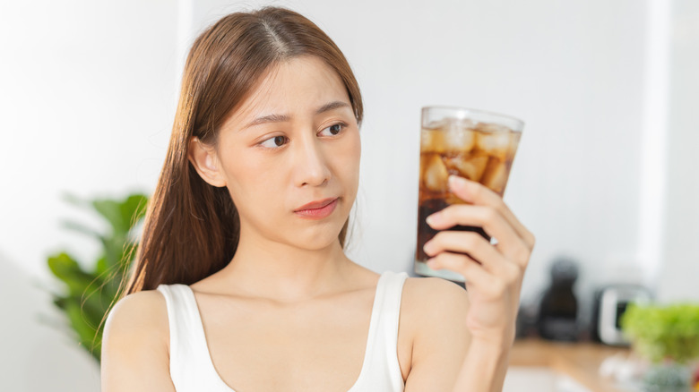 Someone looking at soda