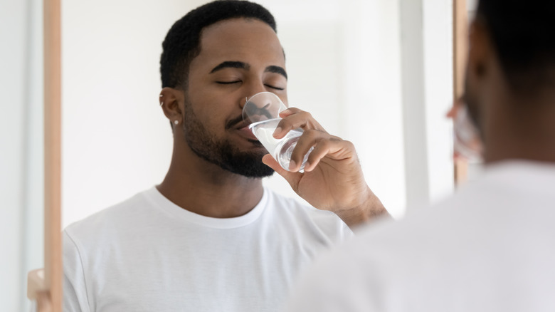 man drinking water