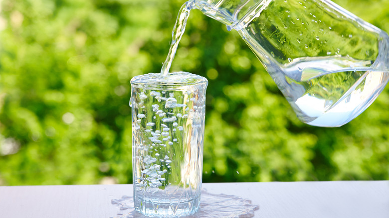 water overflowing from glass