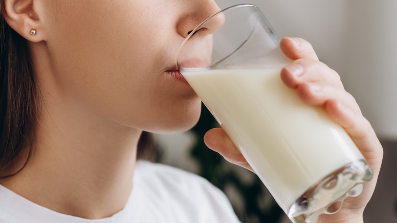 Woman drinking glass of milk