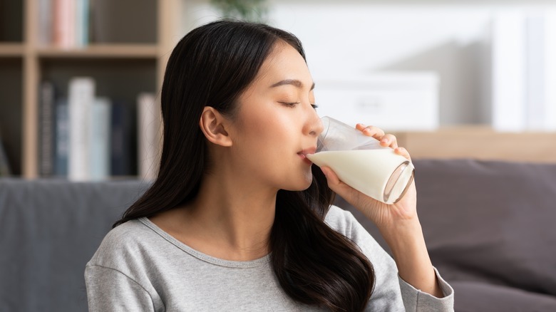 Woman drinking a glass of milk