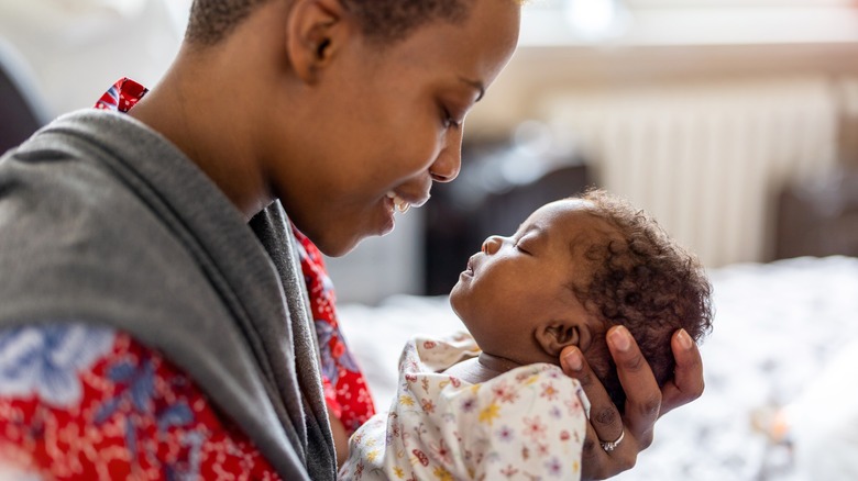 mother looking at newborn baby