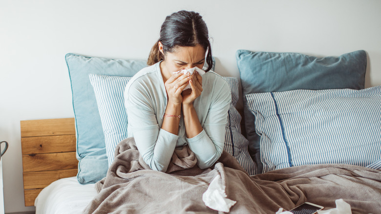 woman in bed with cold