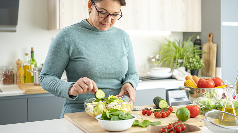 woman making a healthy salad