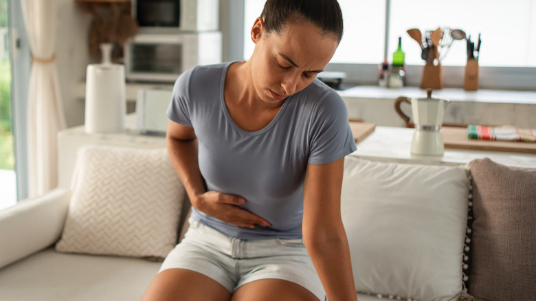 woman feeling pain of constipation