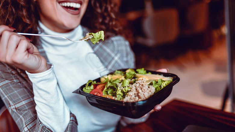 woman eating tuna salad