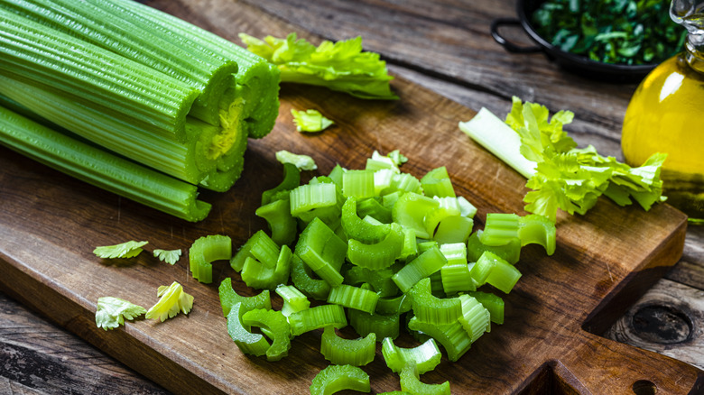 chopped celery on a cutting board