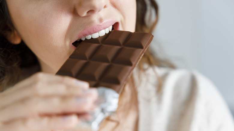 Woman eating chocolate