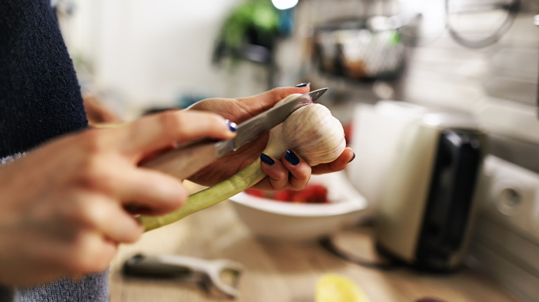 Woman peeling garlic